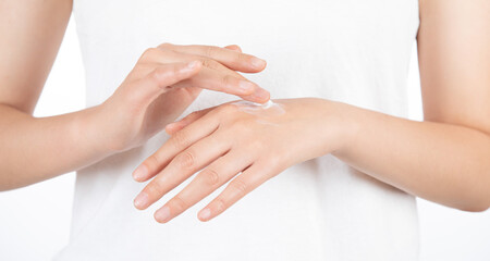 scene of woman applying lotion on her hands