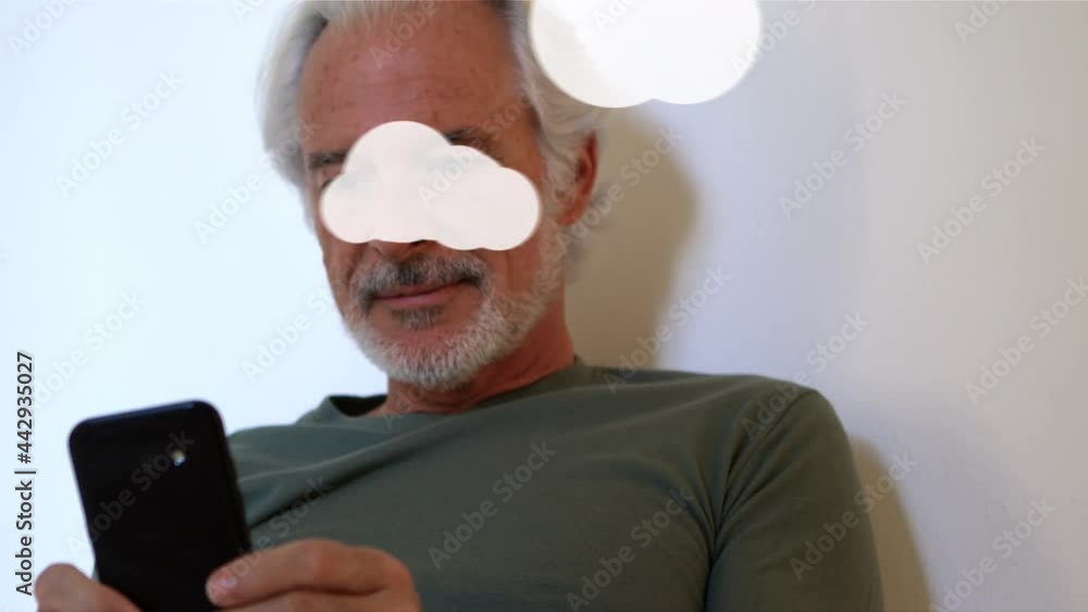Poster animation of clouds and digital icons over man using smartphone