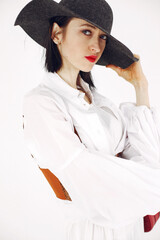 Girl in a fashion image on a white background