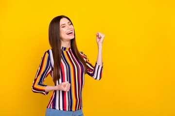 Profile side photo of young attractive woman happy positive smile rejoice victory success isolated over yellow color background