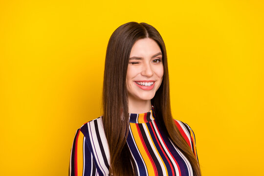 Photo portrait pretty girl winking blinking smiling isolated vivid yellow color background