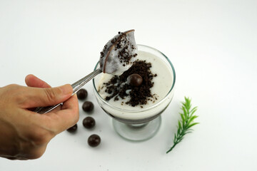 Chocolate pudding with creamy milk and chocolate balls