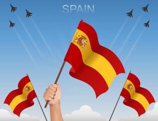 Spain flags flying under the blue sky 