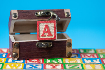 Obraz premium Capital letter A in treasure box