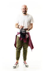 Cheerful laughing young stylish bald bearded hipster with shirt tied around waist. Full body portrait isolated on white background