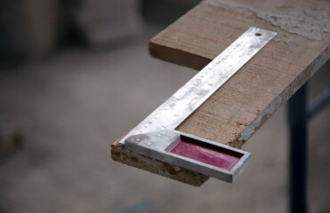Right angle measuring tool with steel ruler for craftsmanship.