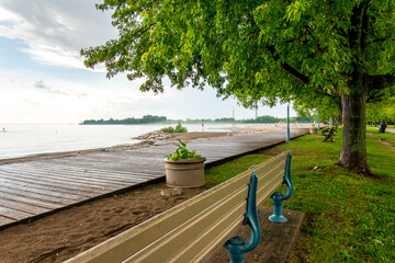 A wooden boardwalk and an empty beach after a rain storm in Toronto's Beaches neighbourhood shot in...