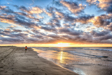 person walking on the beach