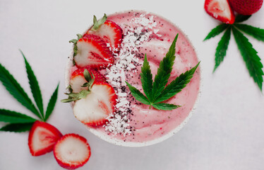 Delicious summer smoothie bowl with Cannabis CBD oil for medicinal treatments. Marijuana Concept.