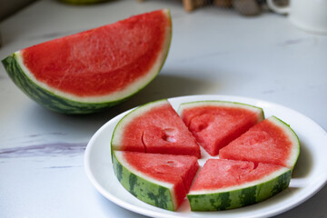 fresh watermelon slices in a white plate