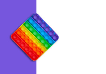Silicone toy antistress popit. New trend. Colorful anti stress sensory toy fidget push pop it . Flat lay with copyspace.
