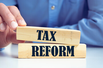 tax reform word written on wood block. 