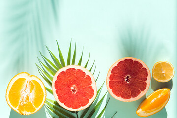 fresh summer fruit and water galss on blue background flat lay