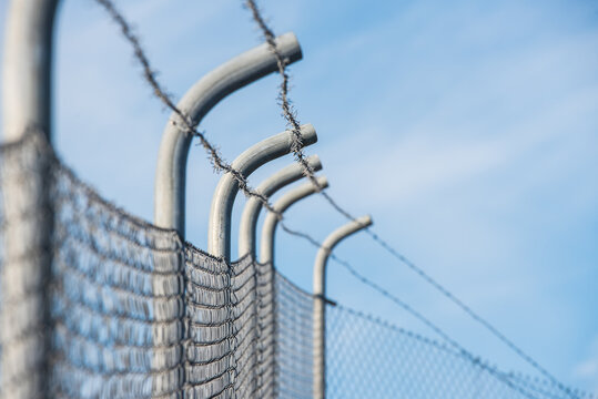 Security fence and barbed wire