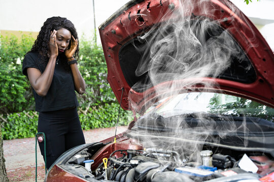 Woman Talking To Reliable Car Mechanic. Breakdown