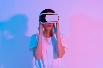 portrait of young asian girl wearing virtual reality glasses