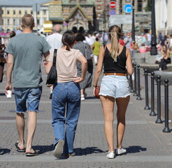 A group of people in various denim clothes, Griboyedov Canal Embankment, St. Petersburg, Russia, July 2021