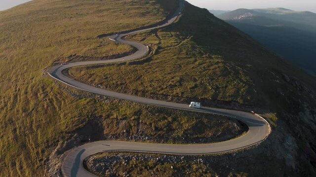Aerial view of RV / Campervan driving on Transalpina mountain road, Romania