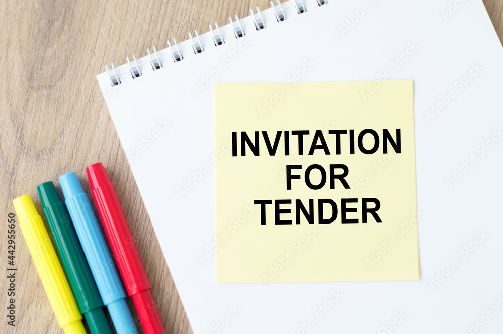 Poster notebook with yellow card with text invitation for tender