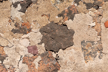 old wall of a town house formed by different construction materials