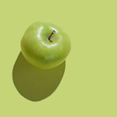 Fresh Green Apple isolated on green background
