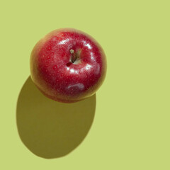 Fresh Red Apple isolated on green background