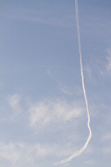 Fototapeta na wymiar Airplane in blue sky with white clouds