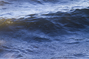 Waves and ripples on river water surface