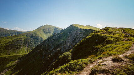 Amazing mountain landscape with blue sky with white clouds, sunny summer day in Carpathians, Ukraine