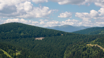 Amazing mountain landscape with blue sky with white clouds, sunny summer day in Carpathians, Ukraine
