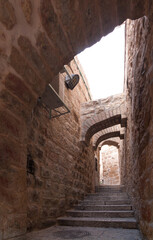 Fototapeta na wymiar Jerusalem Old City street with steps and arches