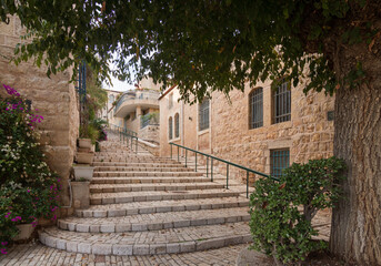 Jerusalem historic neighborhood Yemin Moshe. Big stone staicase and tree