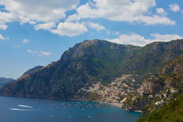 One of the best resorts of Italy with old colorful villas on the steep slope, nice beach, numerous yachts and boats in harbor and medieval towers along the coast, Positano.