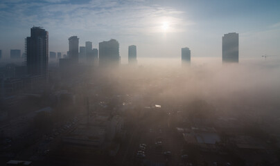 Fog in Tel Aviv city. Sunny top view above aerial panorama