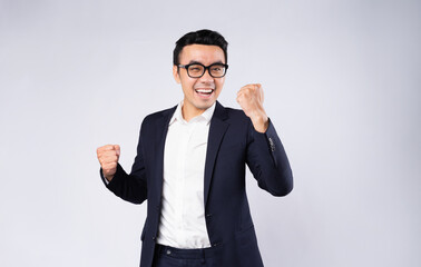 Portrait of business man wearing suit, isolated on white background