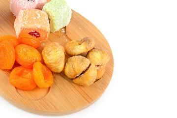 Dried figs and apricots isolated on white.