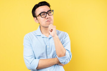 male portrait wearing shirt, isolated on yellow background