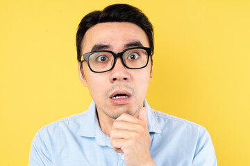 male portrait wearing shirt, isolated on yellow background