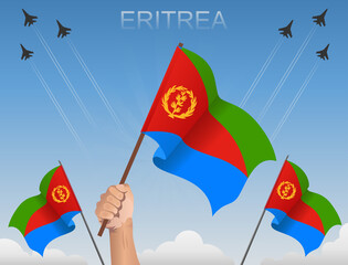 Eritrea flags fluttering under the blue sky