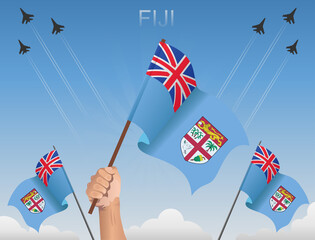 Fiji flags fluttering under the blue sky