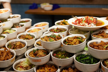 Assorted Chinese food set. Chinese noodles, fried rice, dumplings, peking duck, dim sum, spring rolls. Famous Chinese cuisine dishes on table. Top view. Chinese restaurant concept. Asian style banquet