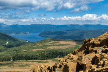 A valley with a mountain in the background - Gros Morne, Newfoundland, Canada