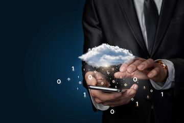 On the phone businessman working with cloud computing with binary code on blue background.