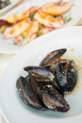 Mussels in the bowl in a white wine sauce
