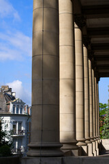 Outside pillars of roman catholic church named Liebfrauen at City of Zurich on a cloudy summer day. Photo taken July 2nd, 2021, Zurich, Switzerland.