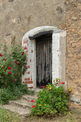 Fototapeta na wymiar wooden front door to enter a rural home in a mountain village