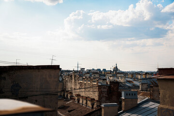Naklejka premium Cityscape view over the rooftops of St. Petersburg. View of the rooftops against the sky