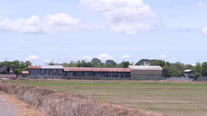 Obraz premium Storage shed at a rice field in Phichit province