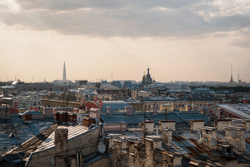 Obraz premium Cityscape view over the rooftops of St. Petersburg. View of the rooftops against the sky