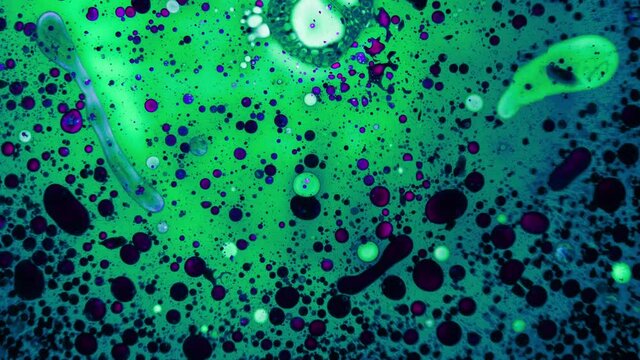 Abstract colorful paint reaction. Psychedelic liquid light show, dye patterns in water, oil, paint. Marble background for visual effects, motion graphics. Swirl pattern, ink explosion